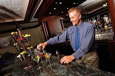 Bartender pouring drinks