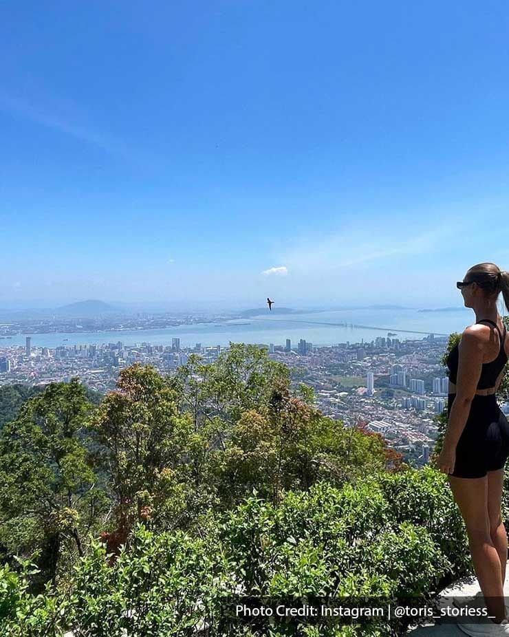 a woman taking a nature hike during her holiday