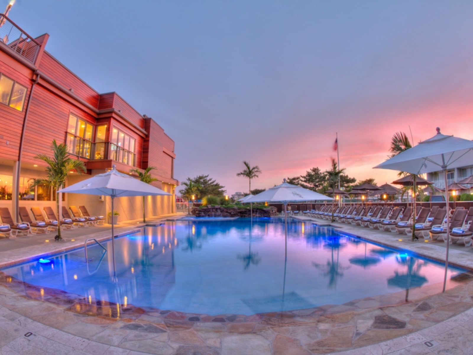 Outdoor heated pool at sunset at our hotel in Avalon NJ