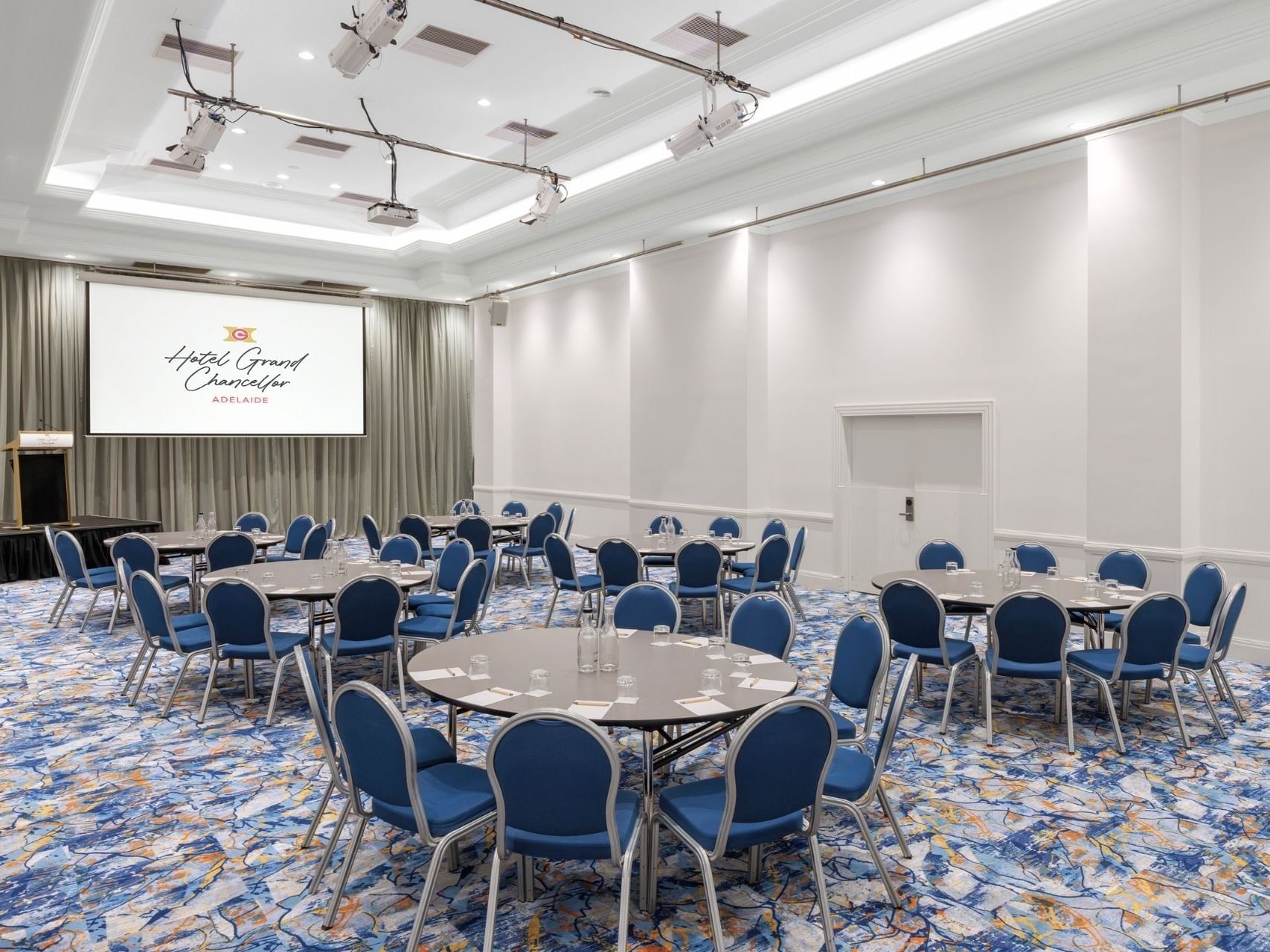 Round tables and chairs in the Hindley 3 event room at Hotel Grand Chancellor Adelaide.