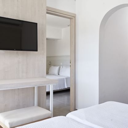 Beds & Tv in Annex Family Land View room at Blue Bay Resort