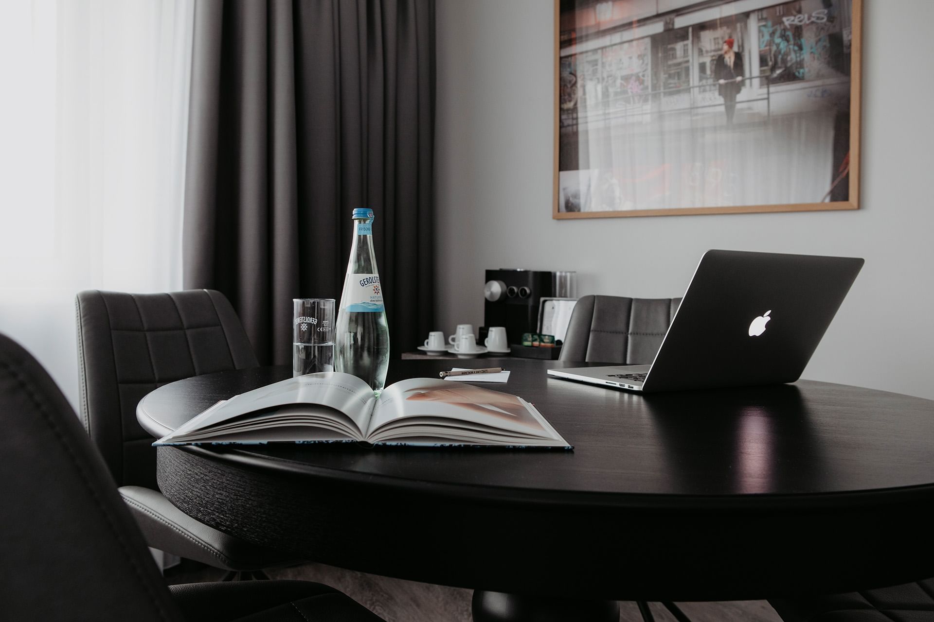 Close-up of a laptop & book on a table at Hotel Berlin Berlin