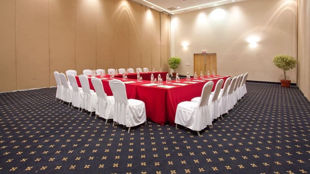 A u-shaped table set up for an event at Gamma Plaza Ixtapa
