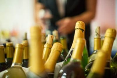 Close-up of liquor bottle tops at Honor’s Haven Retreat