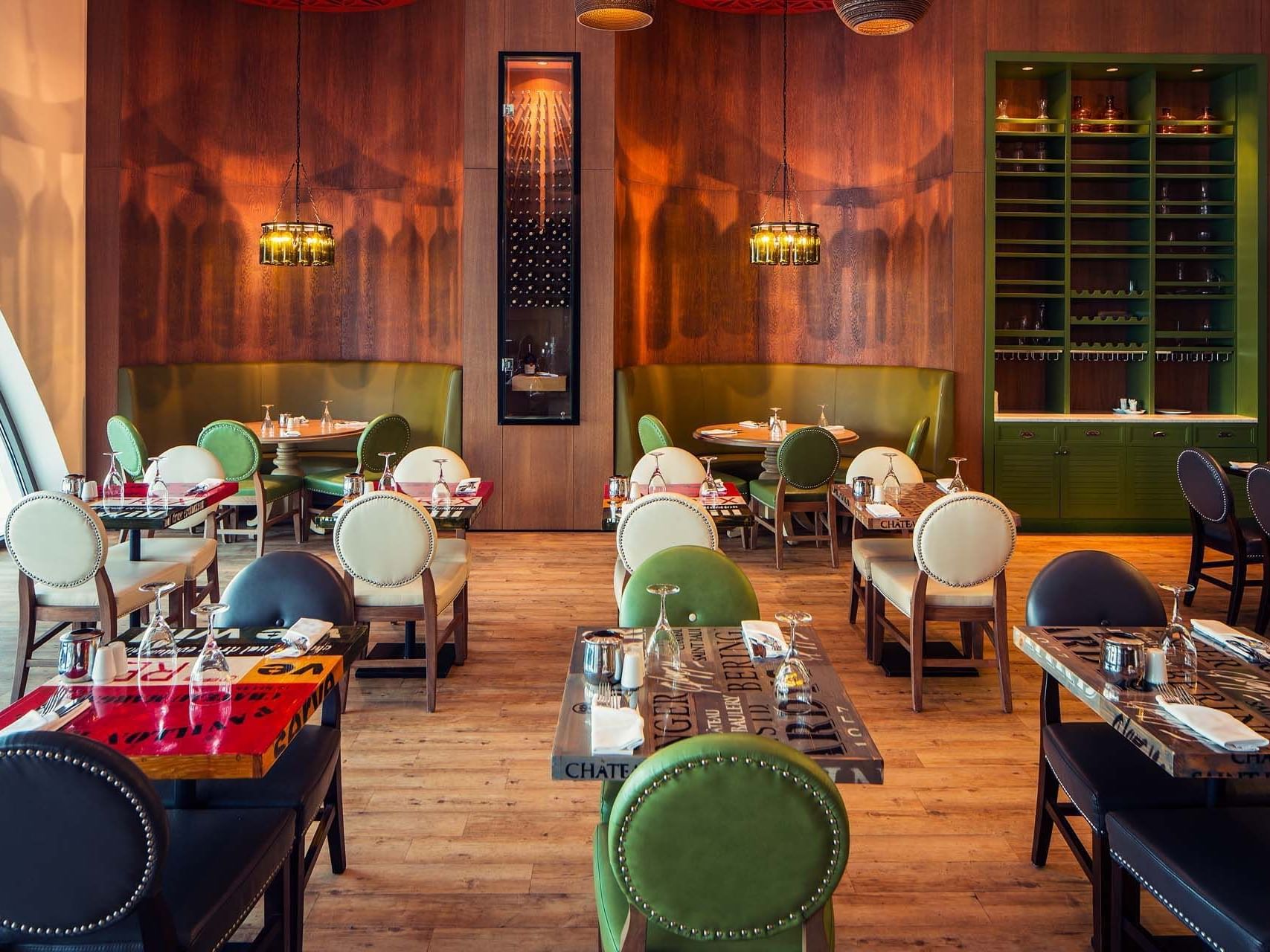 Interior of dining area with tables and chairs in Parkfora Main Restaurant at Titanic Deluxe Lara