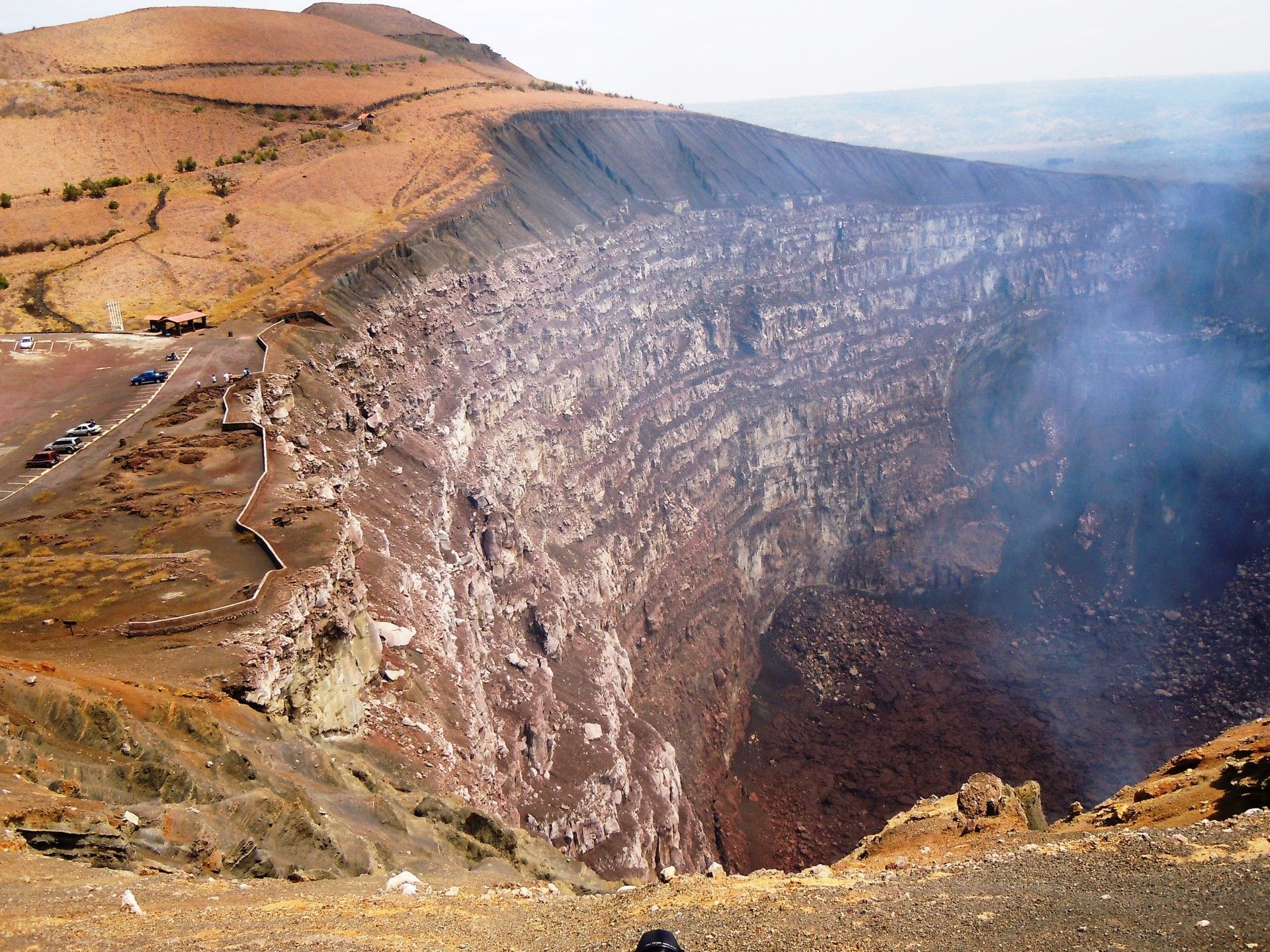 Deep crater by a lookout point under a hazy sky,  near Morgan's Rock Reserve & Ecolodge