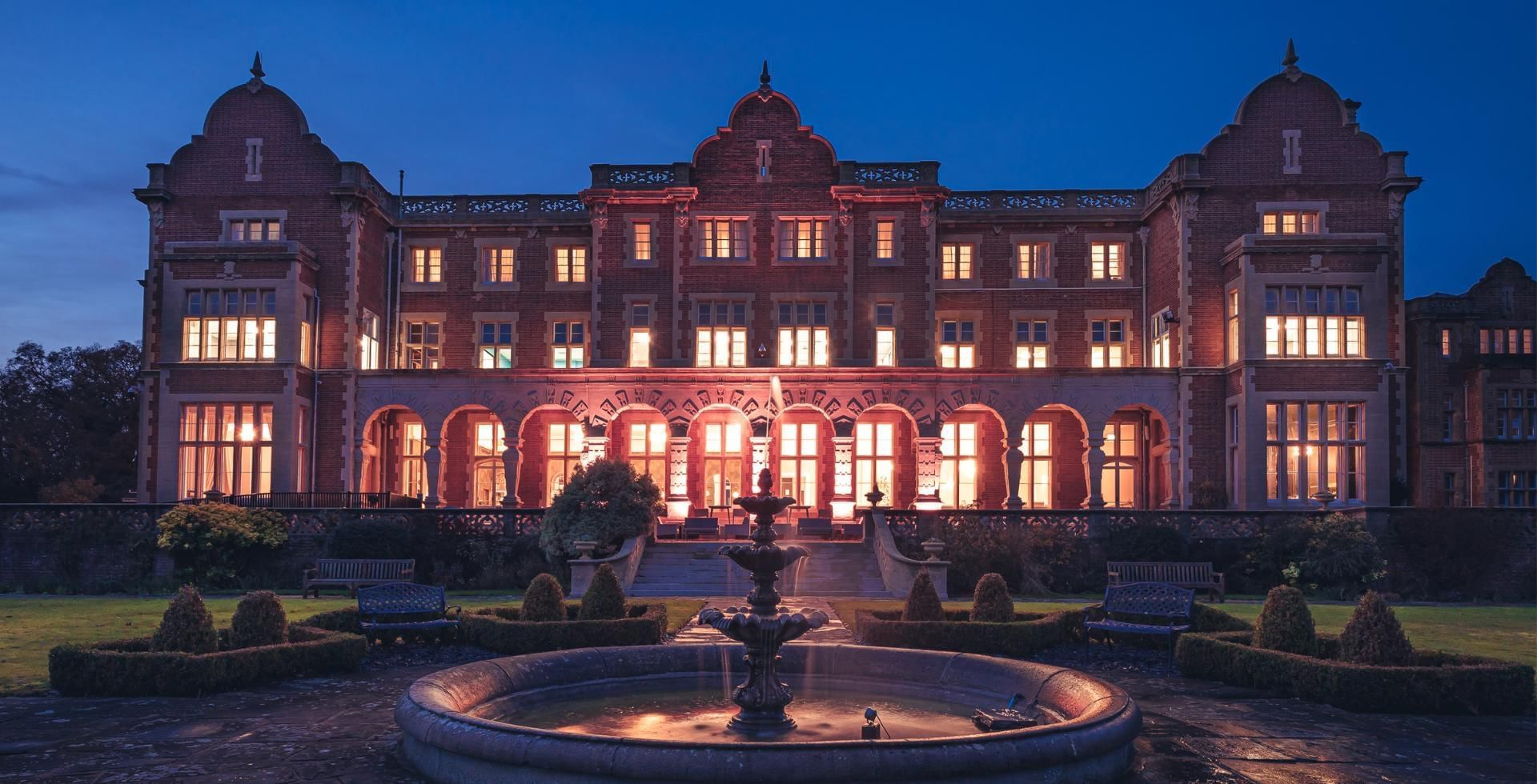 Exterior night shot of Easthampstead Park offering amazing Black Friday Hotel Deals in Berkshire
