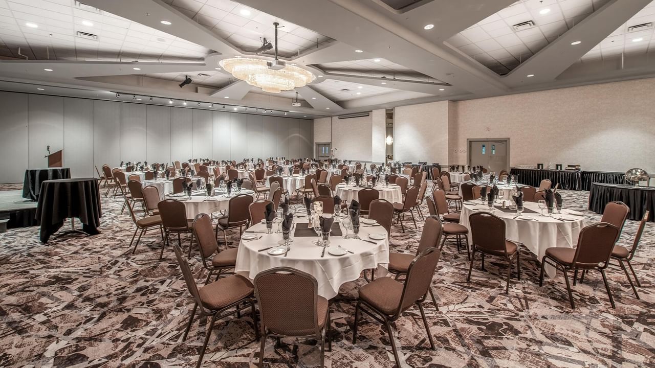 Large conference room with tables and chairs setup.