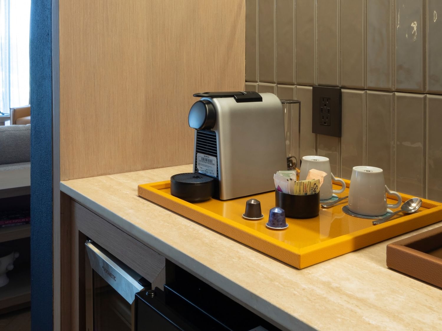 Coffee maker and cups on a yellow tray in the King Superior Viceroys Suite at Camino Real Polanco Mexico in Ciudad de Mexico.