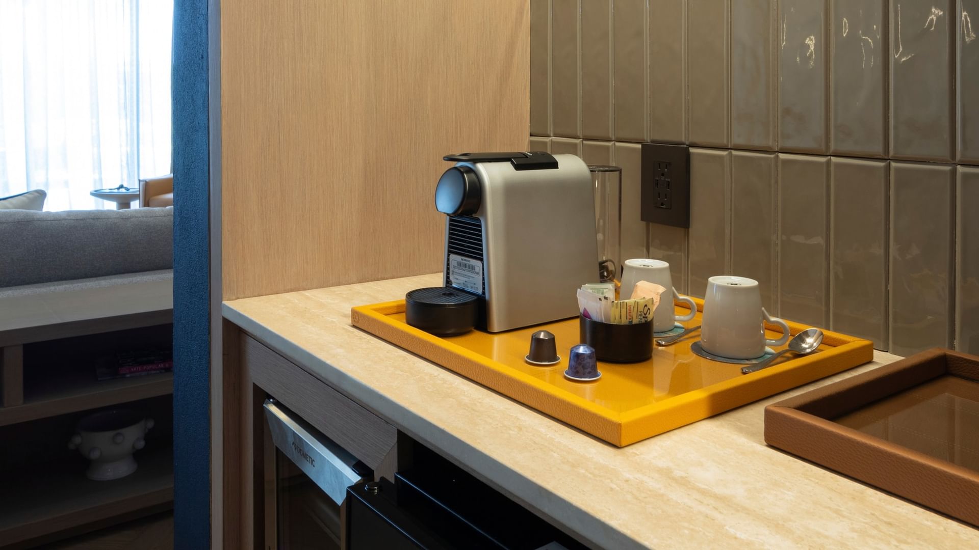 Coffee maker and cups on a yellow tray in the King Superior Viceroys Suite at Camino Real Polanco Mexico in Ciudad de Mexico.