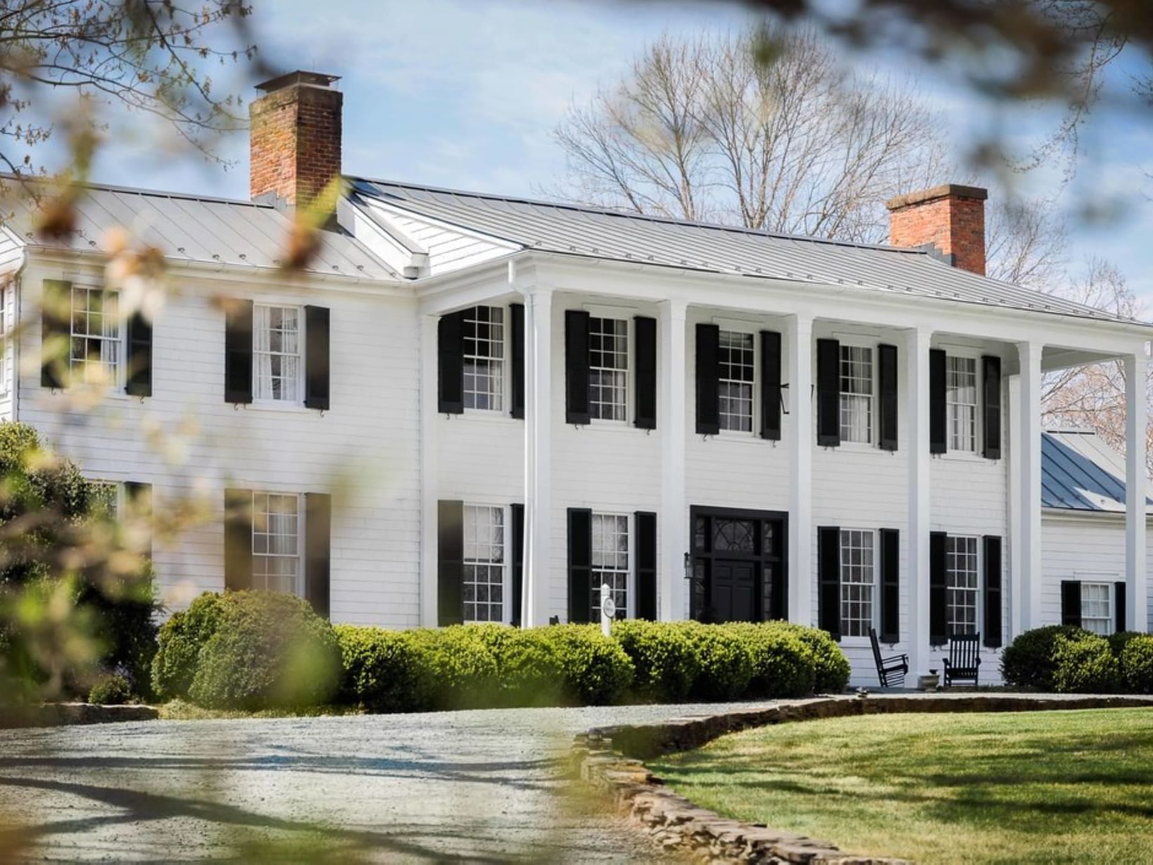 Exterior view of the hotel with green lawn at The Clifton