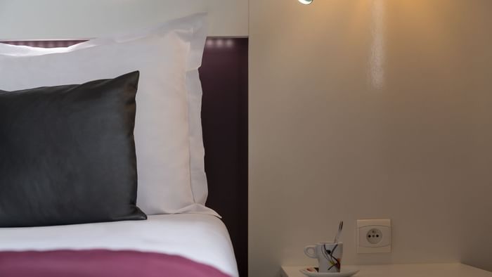 Closeup of a Bedroom with pillows at Hotel Novella Premium