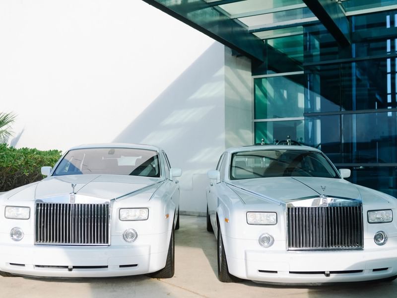 Two Rolls Royce parked near the entrance at Live Aqua Resorts