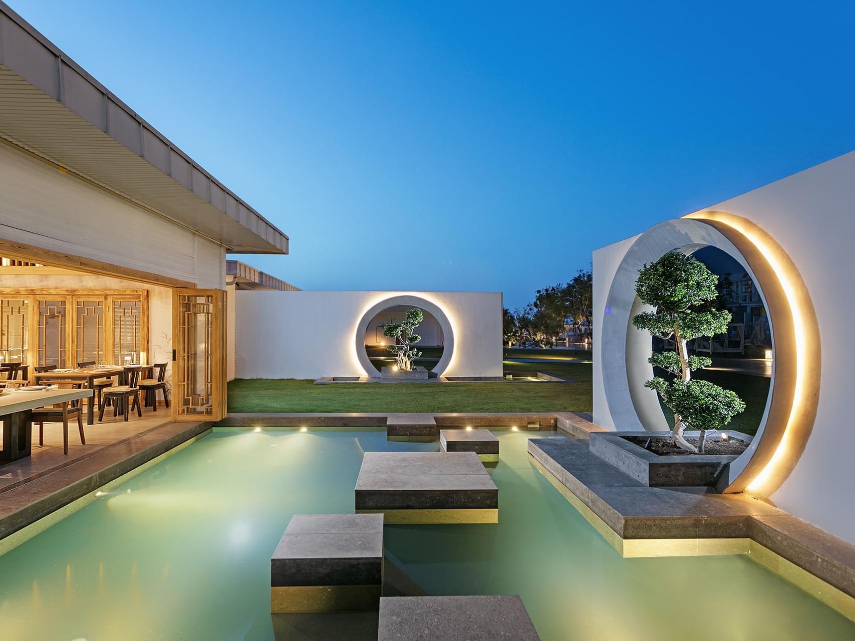 Norı Asian Restaurant with a reflecting pool & stepping stones at Titanic Deluxe Golf Belek