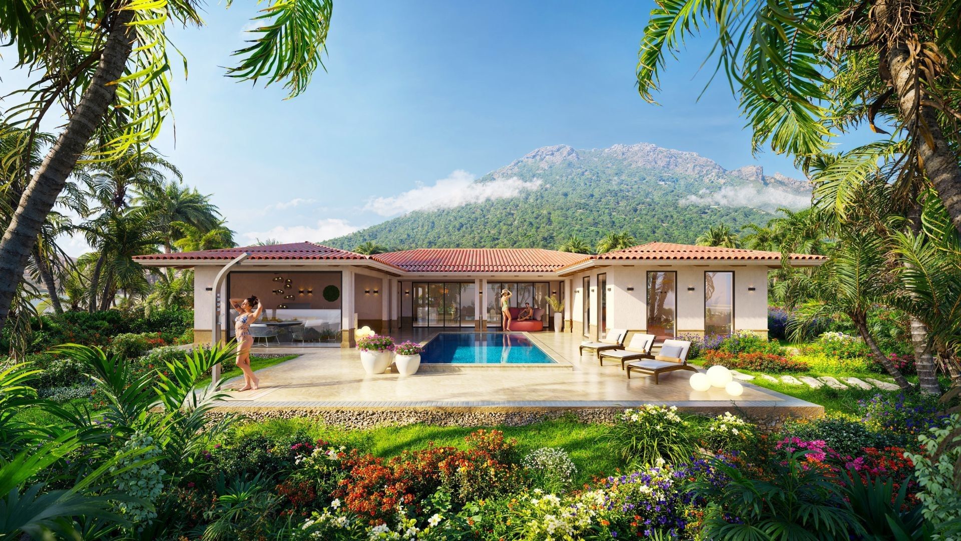 Villa patio with outdoor pool and sun loungers against a lush mountain backdrop at Golden Rock Resort