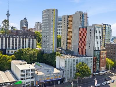 A cityscape with several buildings and trees at Student Living Auckland – Anzac.