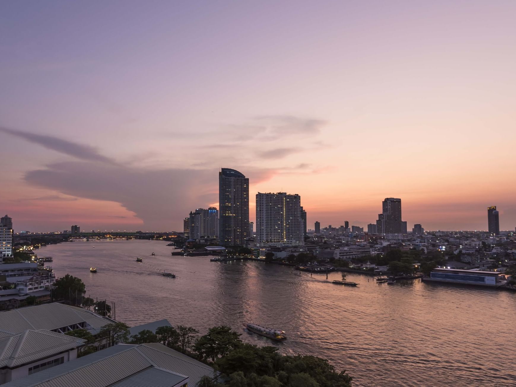 Evening cityscape of the lake from Chatrium Hotel Bangkok