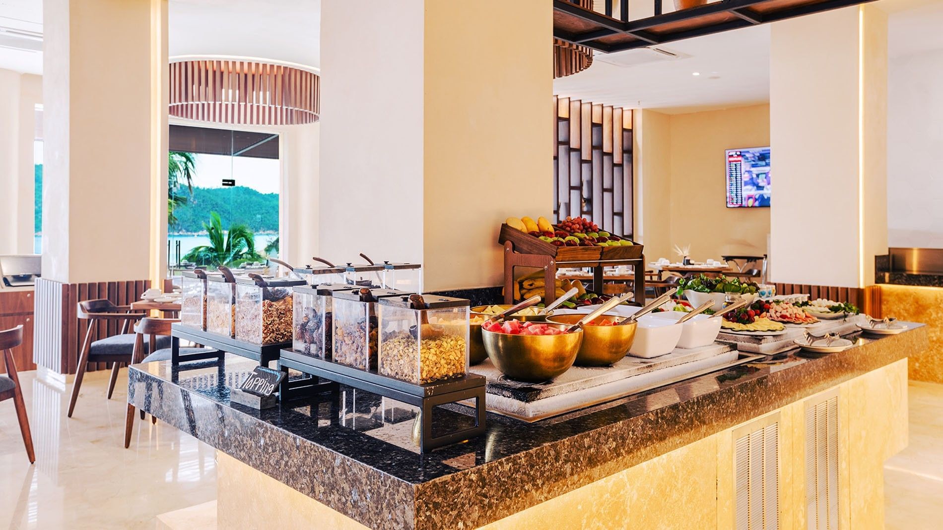 Buffet station with fresh fruit bowls and cereal dispensers in La Huerta at Camino Real Acapulco Diamante