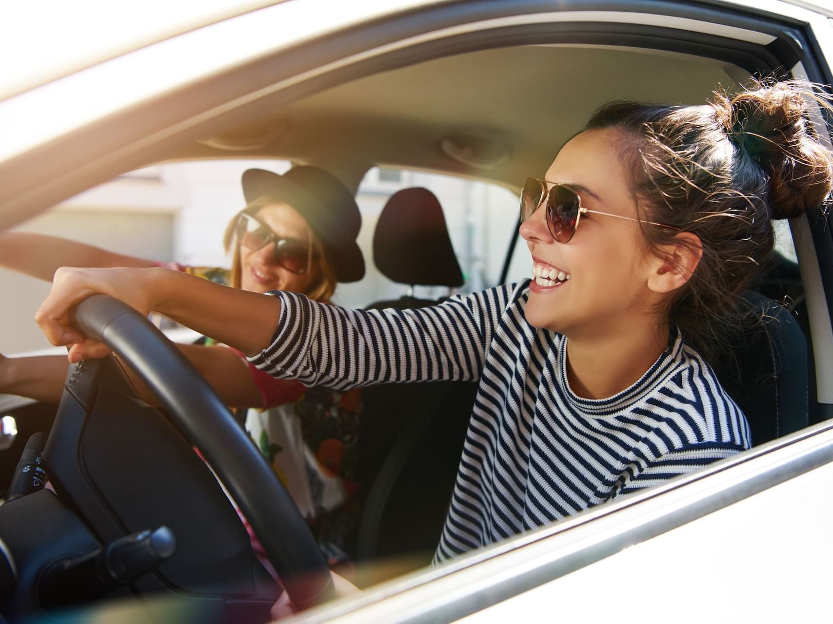 2 Driving women's image for AAA members offer at Hotel Keen