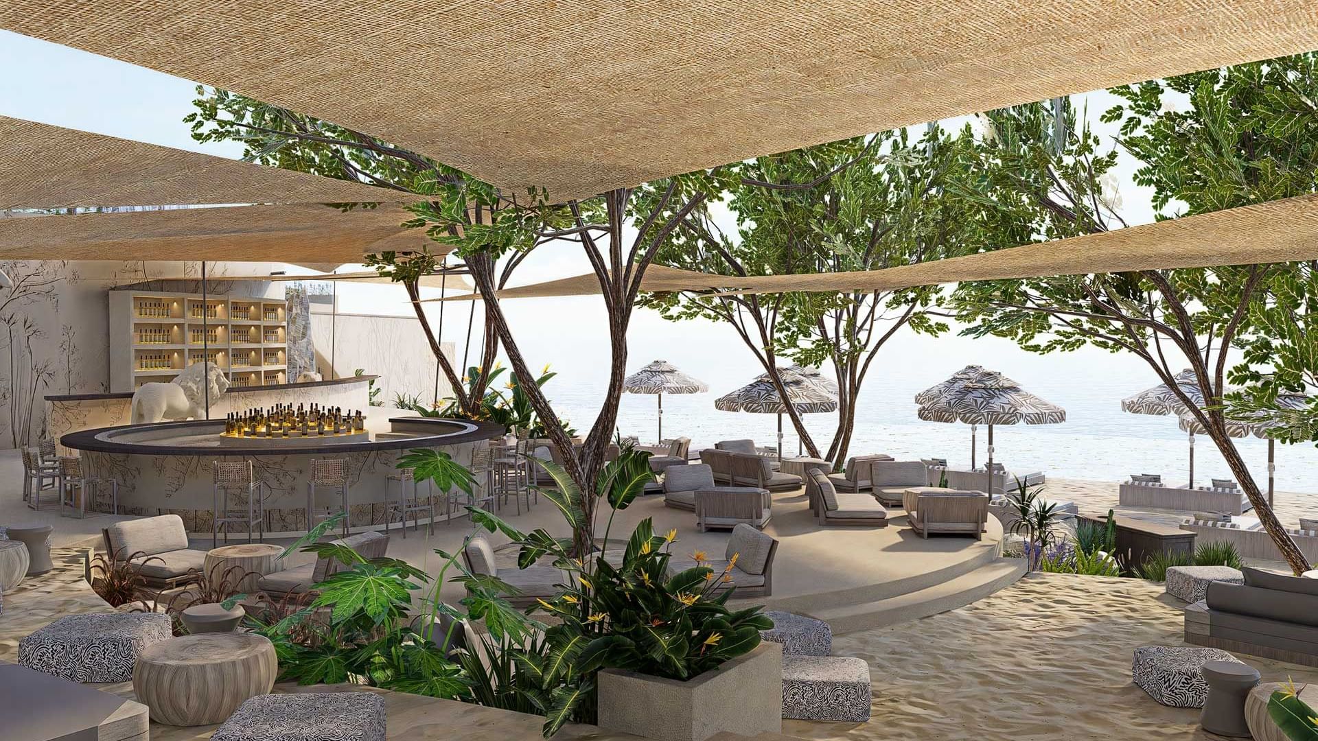 Beachfront bar with shaded seating, surrounded by greenery and beach umbrellas at Titanic Deluxe Sharm El Sheikh
