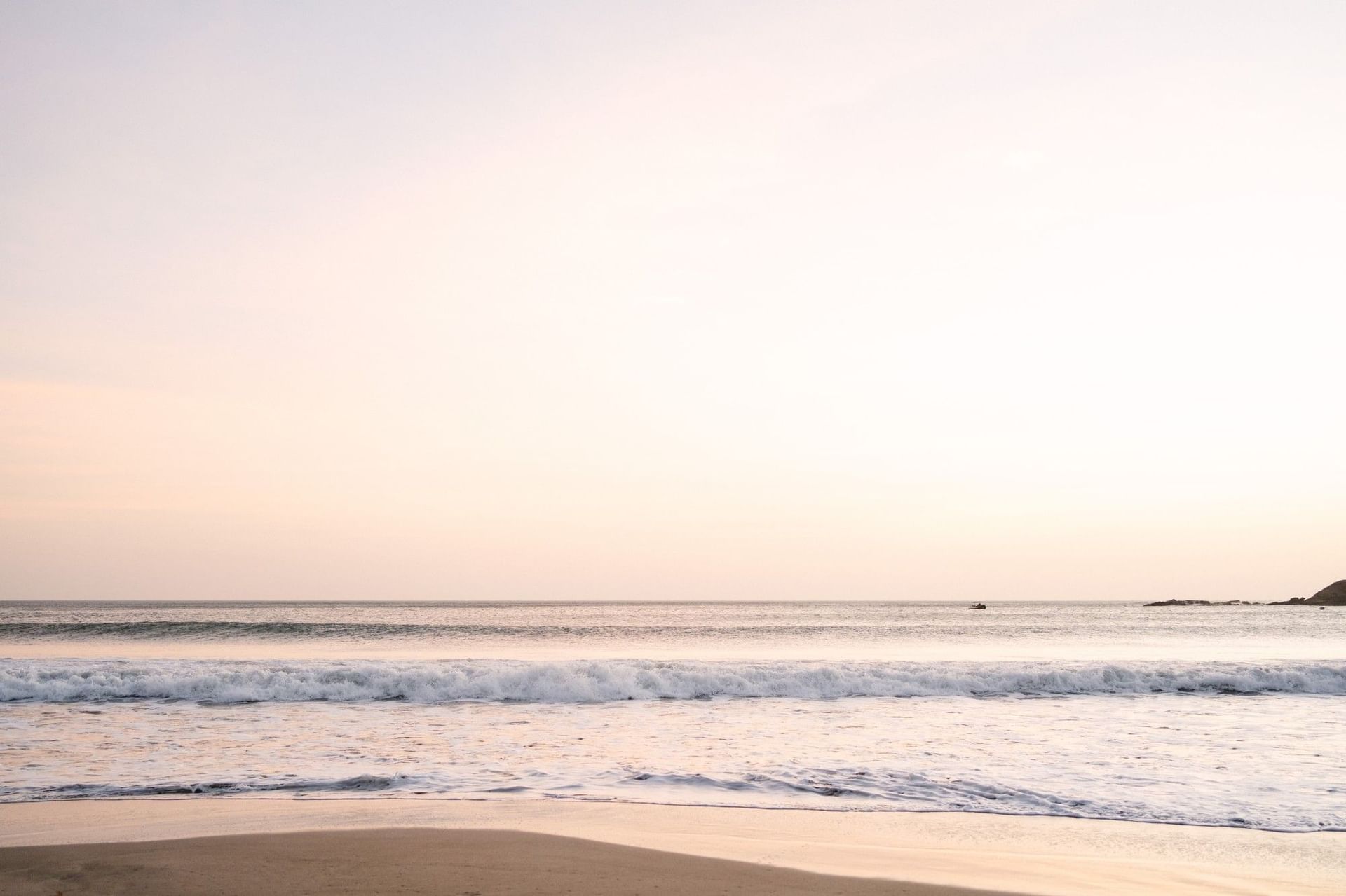 Serene sandy beach at Morgan's Rock, featuring a Nicaragua sustainable travel lodge with mile long beach