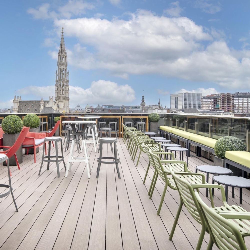 Chairs and tables on the rooftop terrace of the Grand-Place Suite at Warwick Grand-Place Brussels