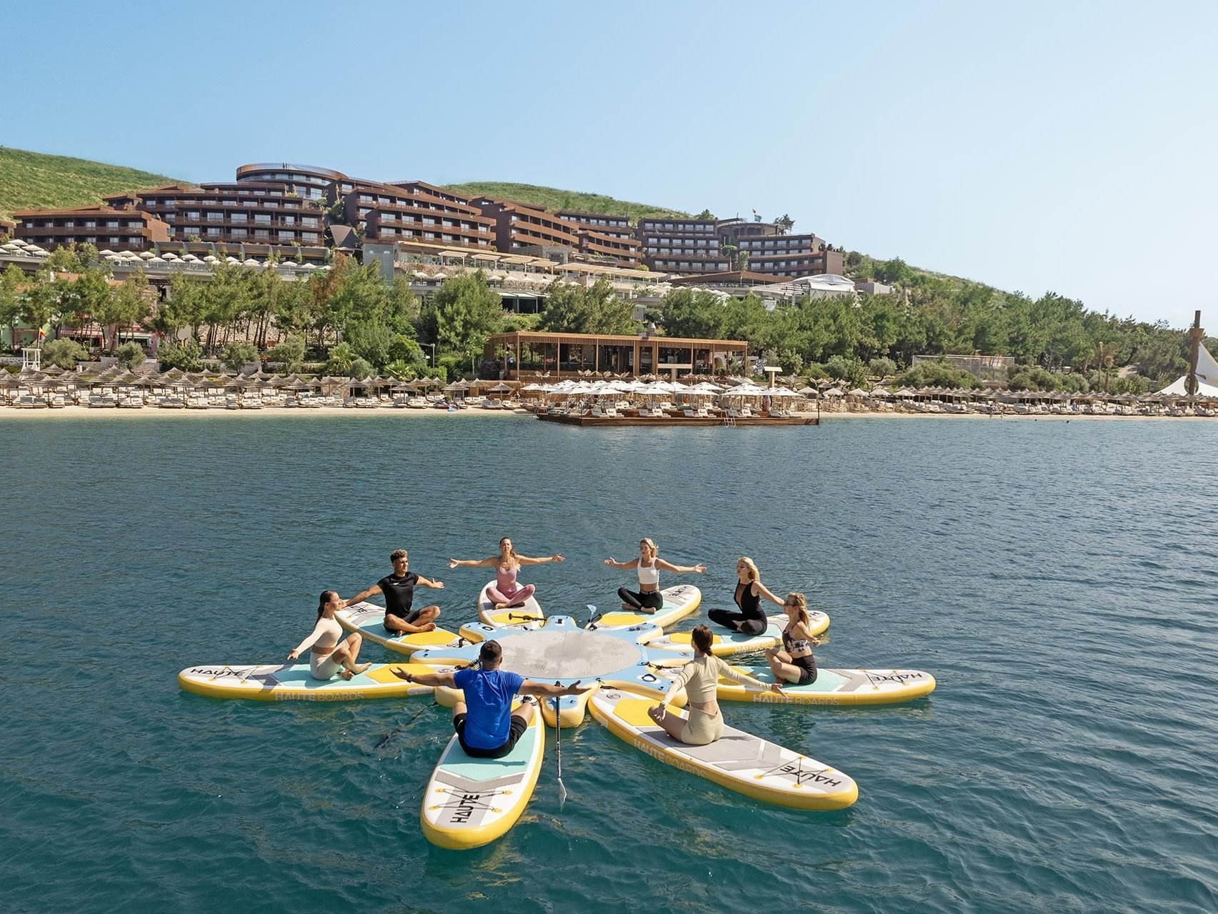 Yoga on surfboards brings serenity at Titanic Luxury Collection Bodrum.