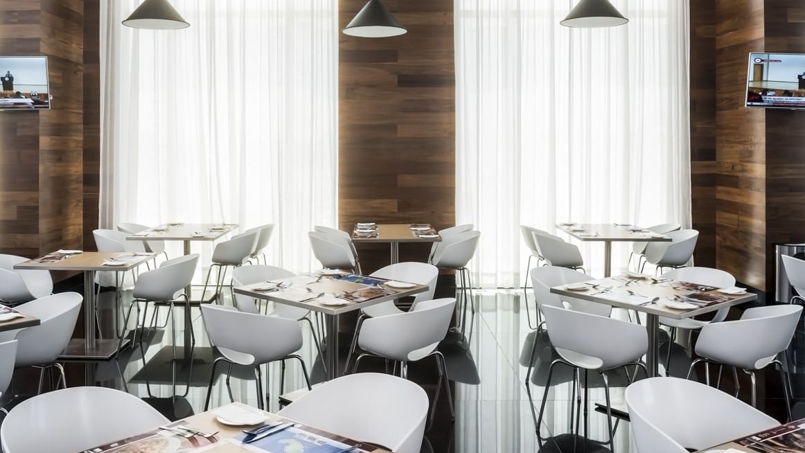 indoor dining area at Fiesta Inn Mérida