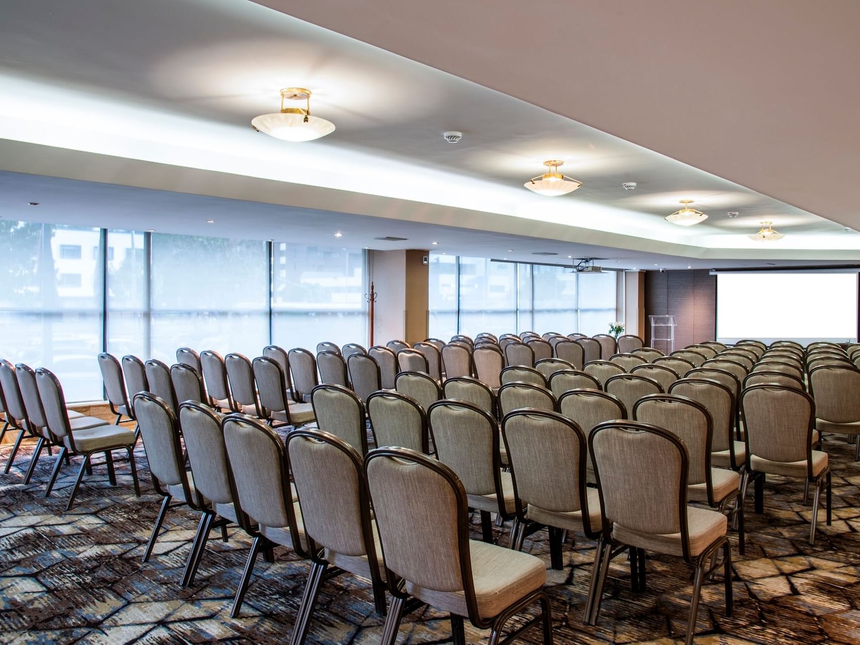 La Candelaria room arranged with chairs at Bogota Plaza Hotel