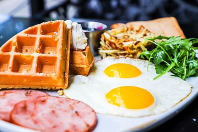 waffle, eggs and canadian bacon
