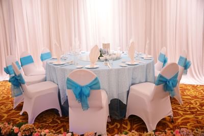 A banquet table adorned with an light blue sash at Eastin Grand Hotel Saigon