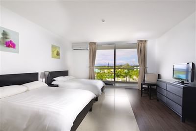 Room with 2 beds & furniture at Playa Blanca Beach Resort