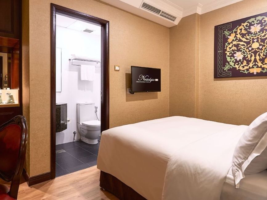 Desk, mirror & amenities in Balcony Room at Nostalgia Hotel Singapore, Tiong Bahru accommodation