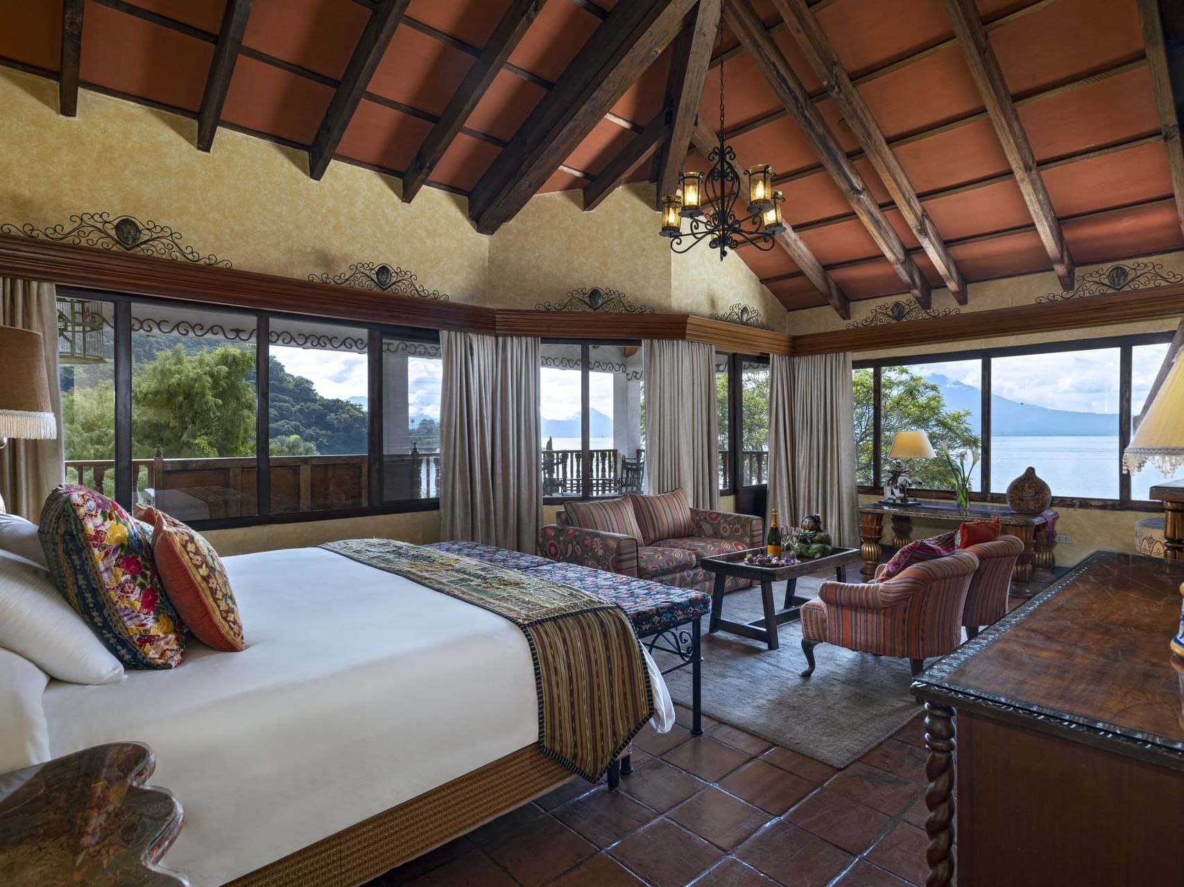 Bed & lounge area with lake view in Master Suite, Hotel Atitlan