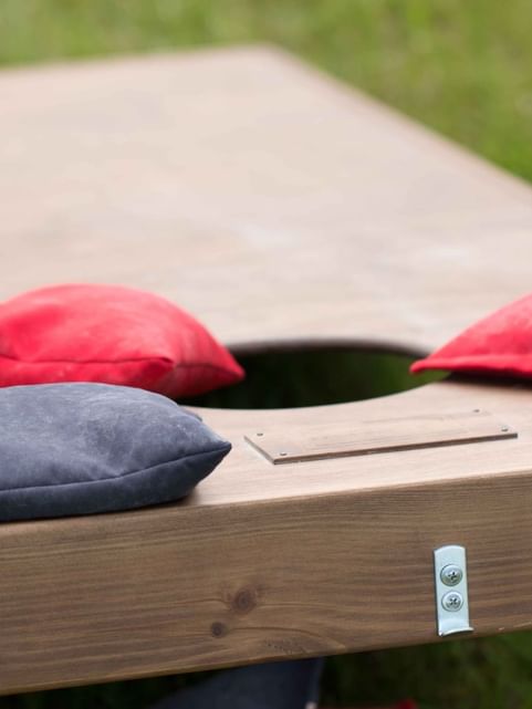 Close-up of a Cornhole set-up arranged outdoors at Cove Pocono Resorts