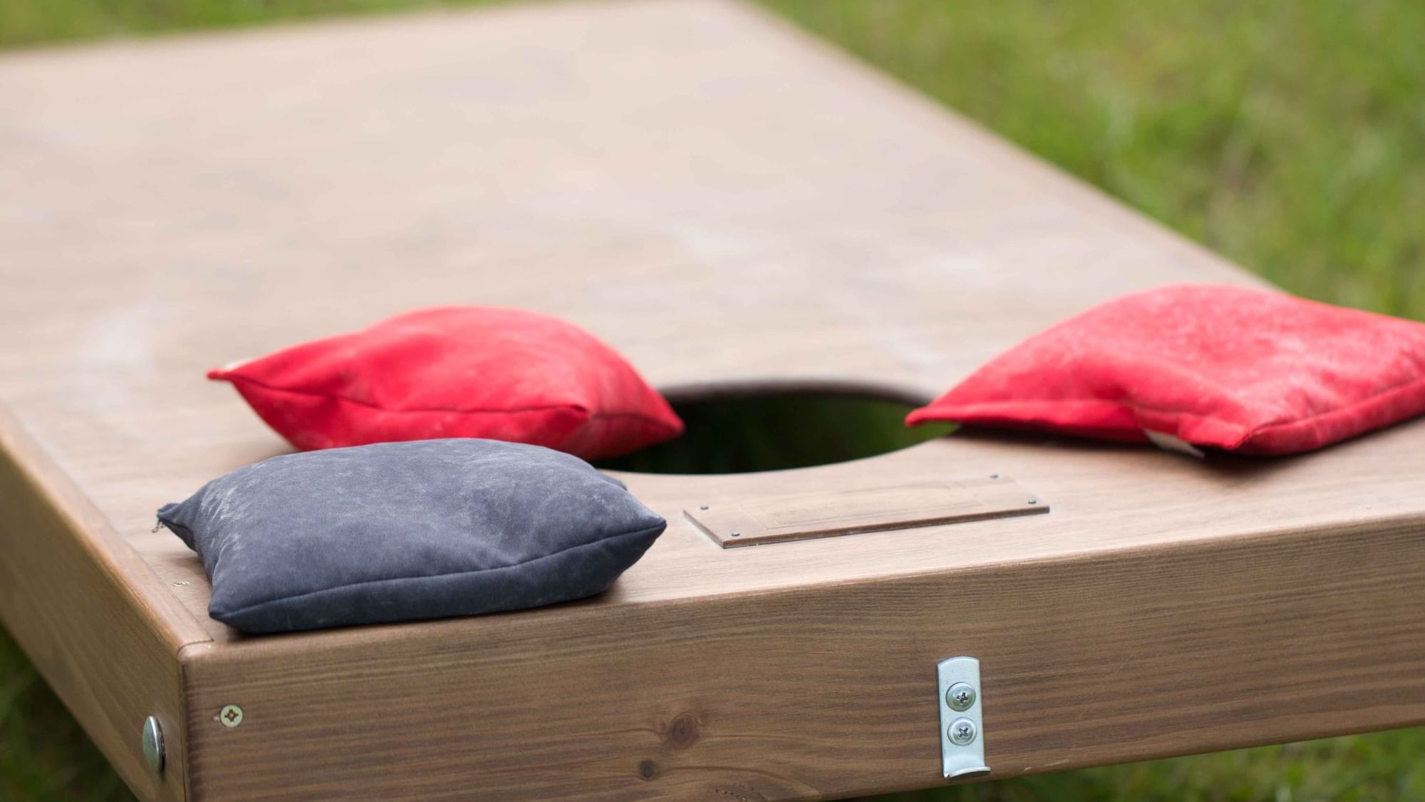 Close-up of a Cornhole set-up arranged outdoors at Cove Pocono Resorts