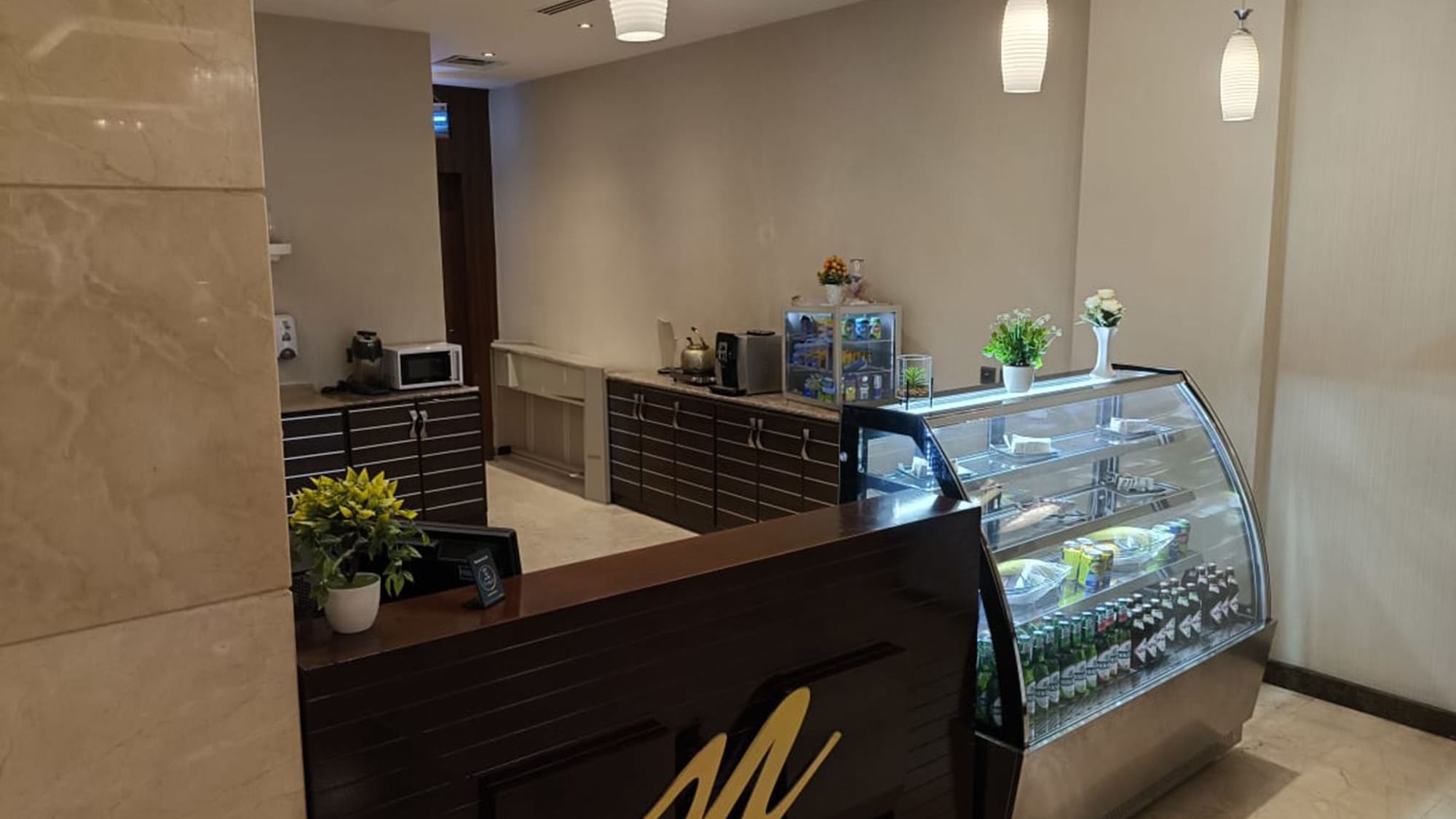 A case filled with pastries and bottled in the Coffee shop at Warwick Hotels & Resorts