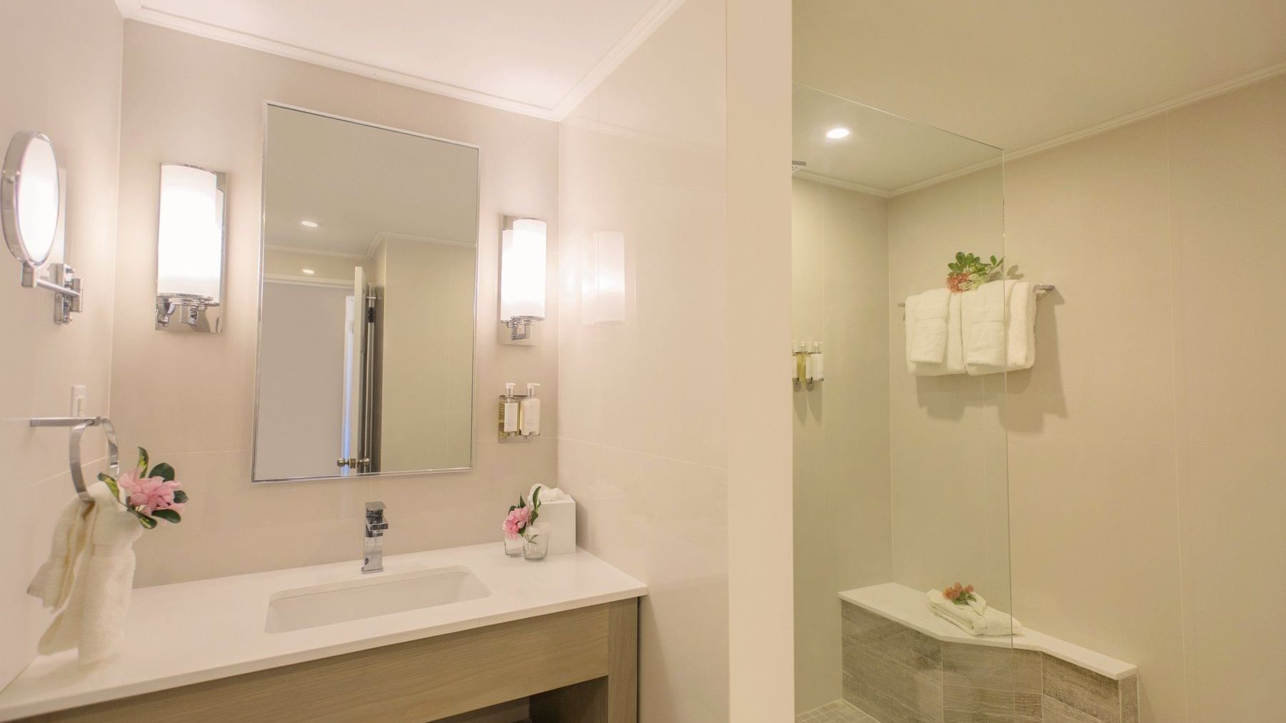 A bathroom with sink, mirror & shower at Bougainvillea Barbados