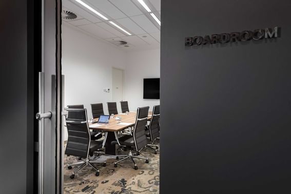 Interior view of the Boardroom with table set-up from the entrance at Melbourne Hotel Perth