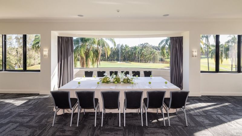 Elegantly set dining table with flowers at Mercure Gold Coast Resort in Carrara.