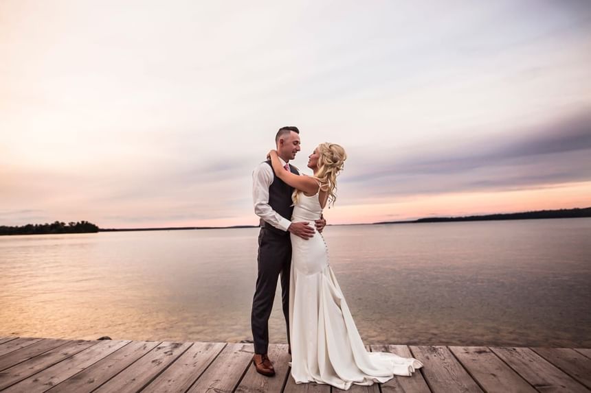Wedding couple enjoying with the sunset at Chase on The Lake