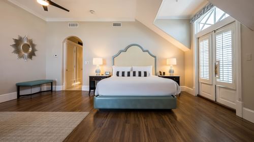 Spacious suite with hardwood floors and a king bed at The Pearl Hotel in Rosemary Beach.