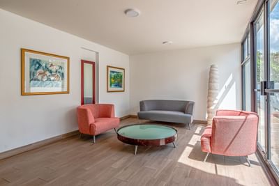 Lavish lounge area with couches & a modern coffee table at Irazu Hotel