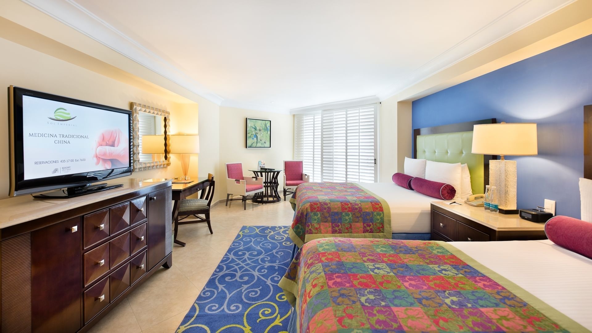 Twin beds & TV in Perla Ocean View Double at Mundo Imperial