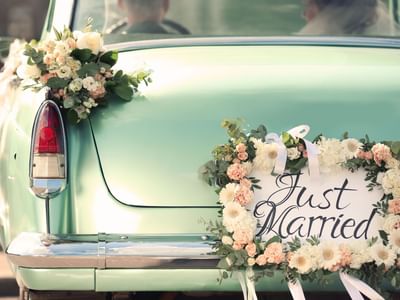Vintage car with Just Married sign board at Starling Hotel Lausanne
