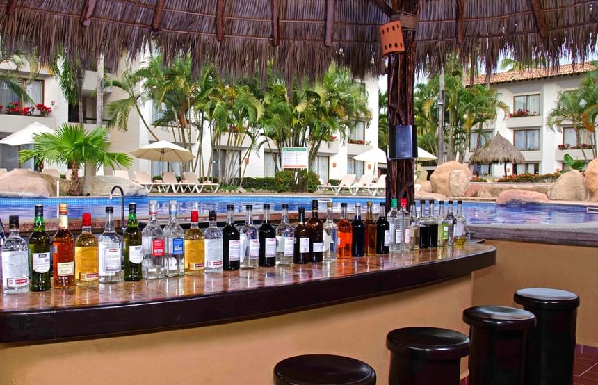 Pool area with a bar counter in Gaviotas Aqua Bar at Plaza Pelicanos Club Beach Resort