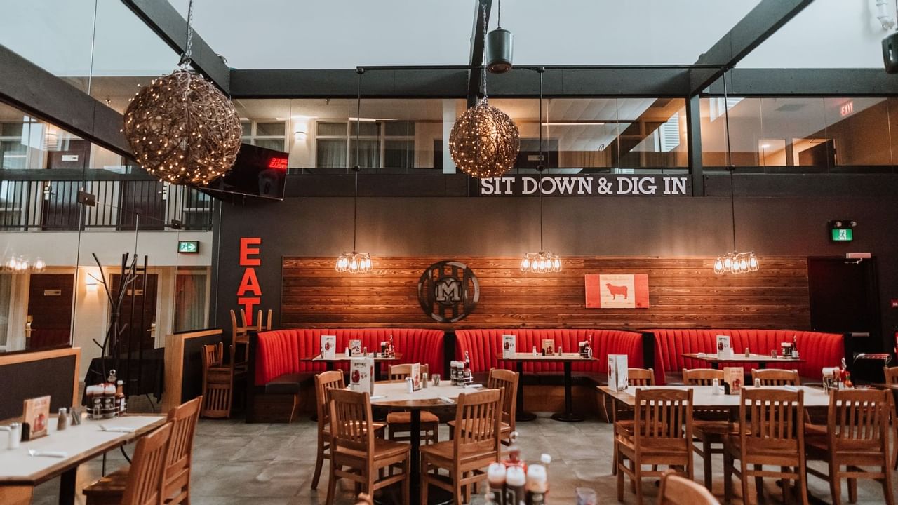 Tables and red booths at restaurant