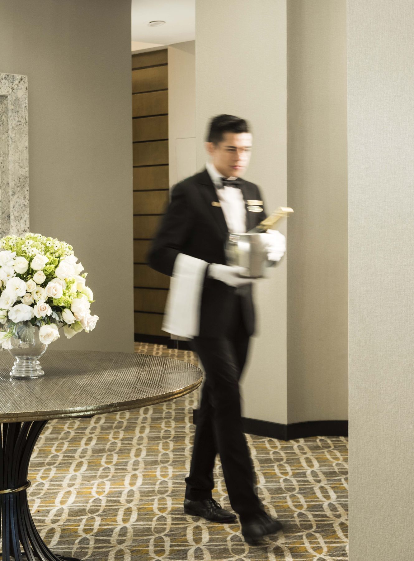 A waiter serving liquor at Marquis Reforma 