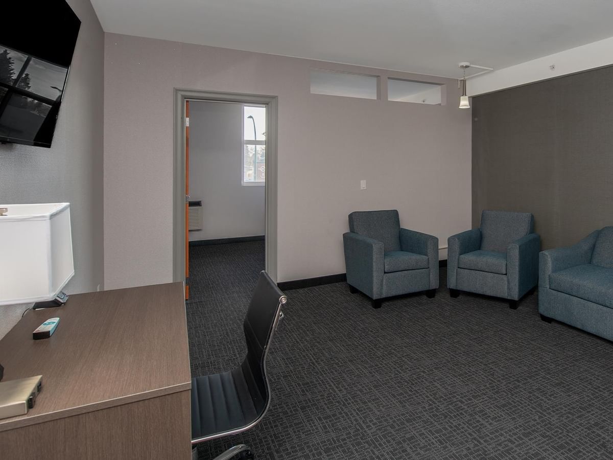 Living area with sofa and chairs.
