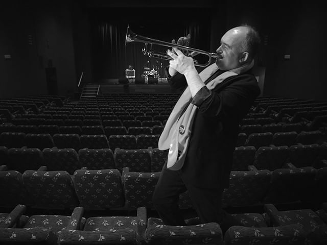 Man playing a trumpet in Jazz festival at Cradle Mountain Hotel